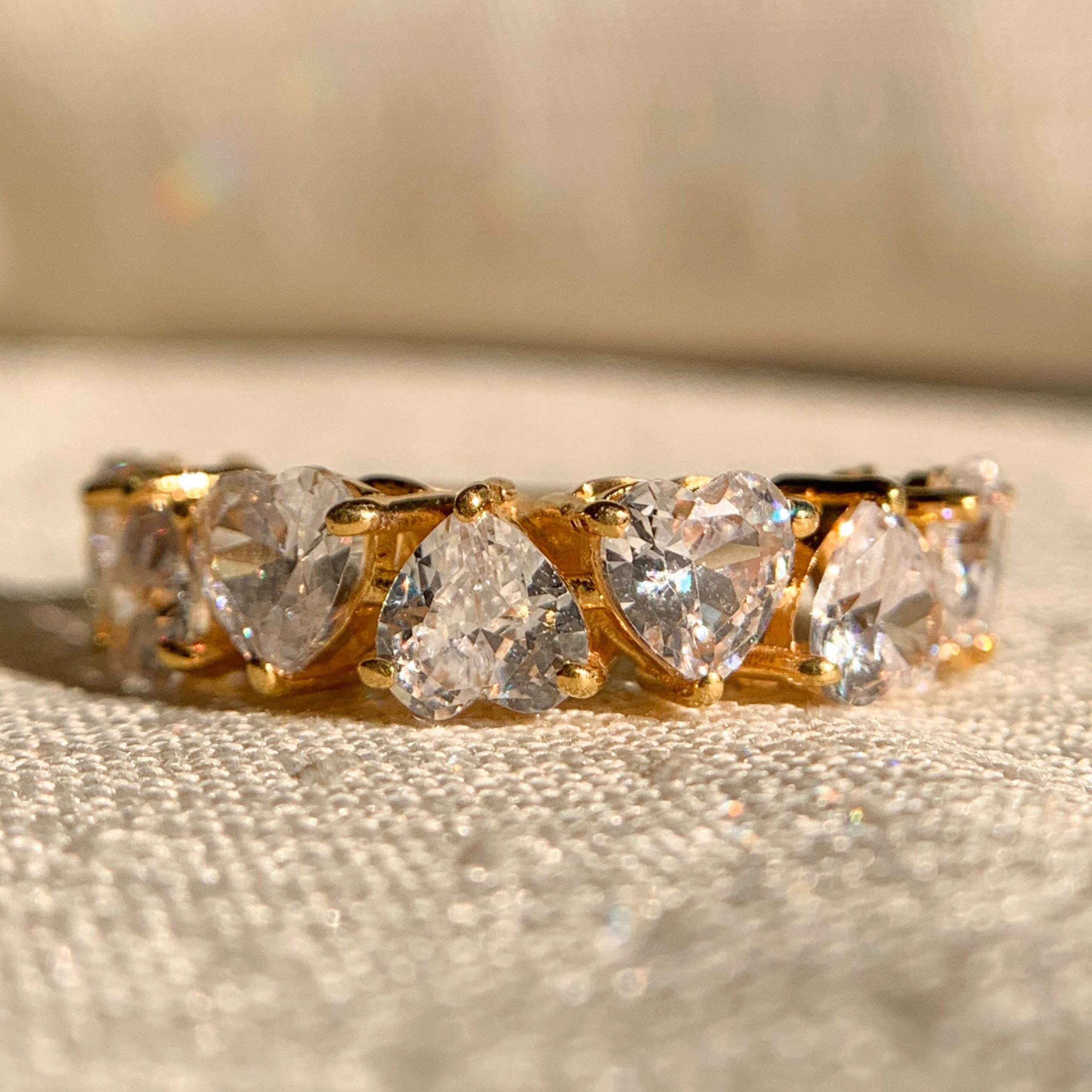 Alternate heart shaped diamond wedding band in white gold